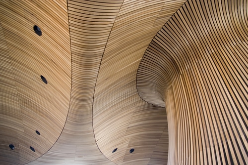 Architectural details of Welsh Assembly building. Wooden planks from sustainable sources. Eco-friendly design at its best. Source: Shutterstock