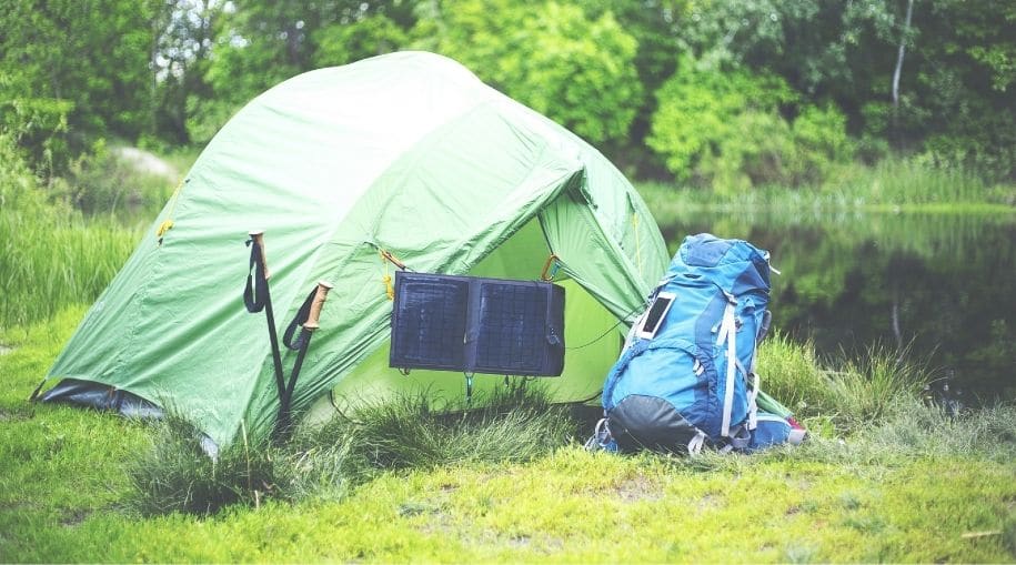 Green tent with a Waterproof Solar Backpack